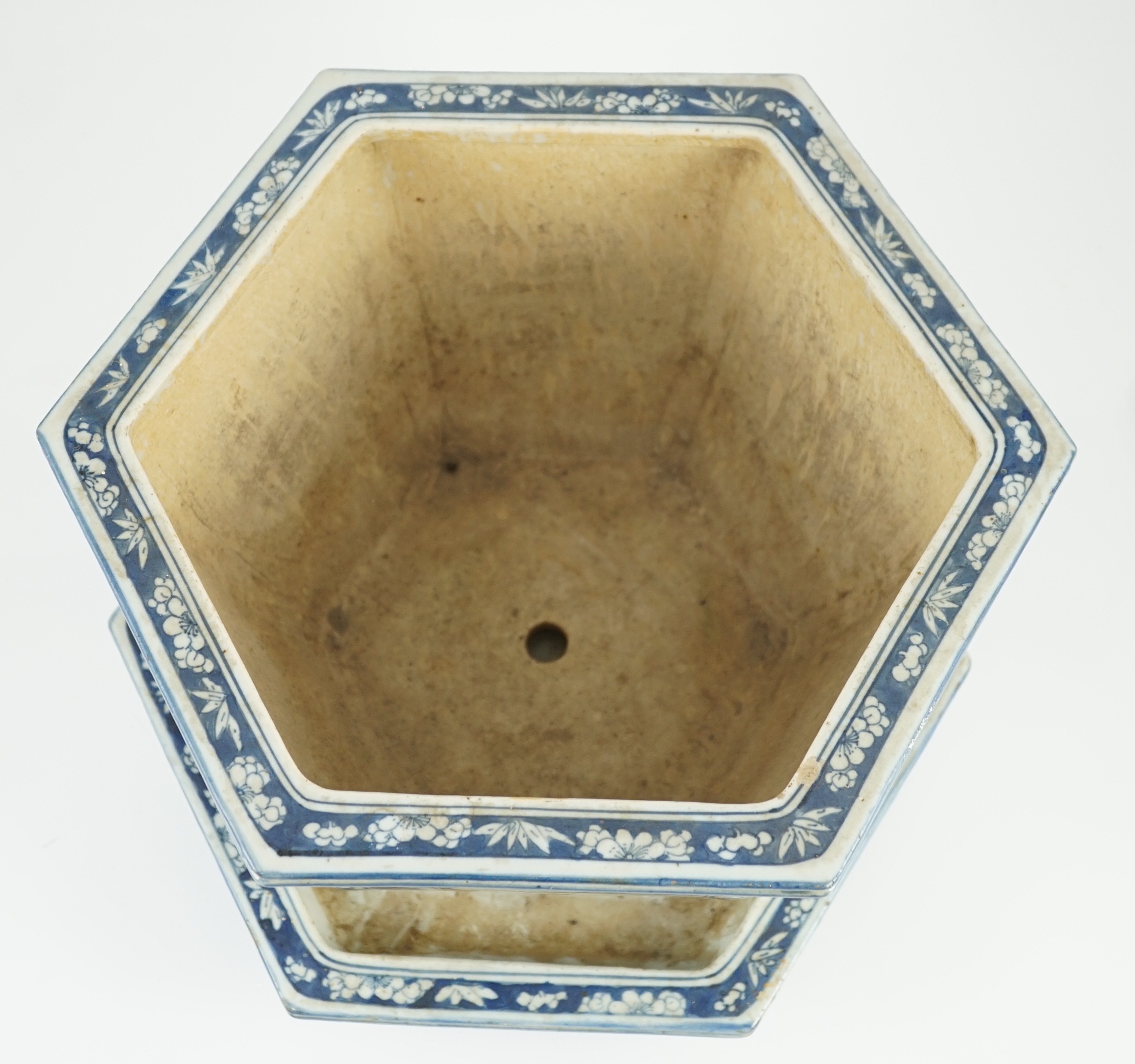 A Chinese hexagonal blue and white planter and underdish, 19th century, 35cm wide, two rim chips